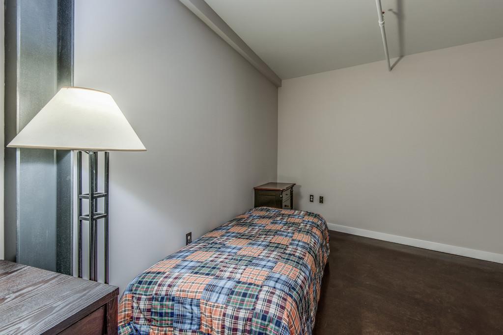 1400 Rosa L Parks Boulevard, Unit 323 Nashville, TN 37208 - Photo 8 of 25 a bedroom with a bed and a table