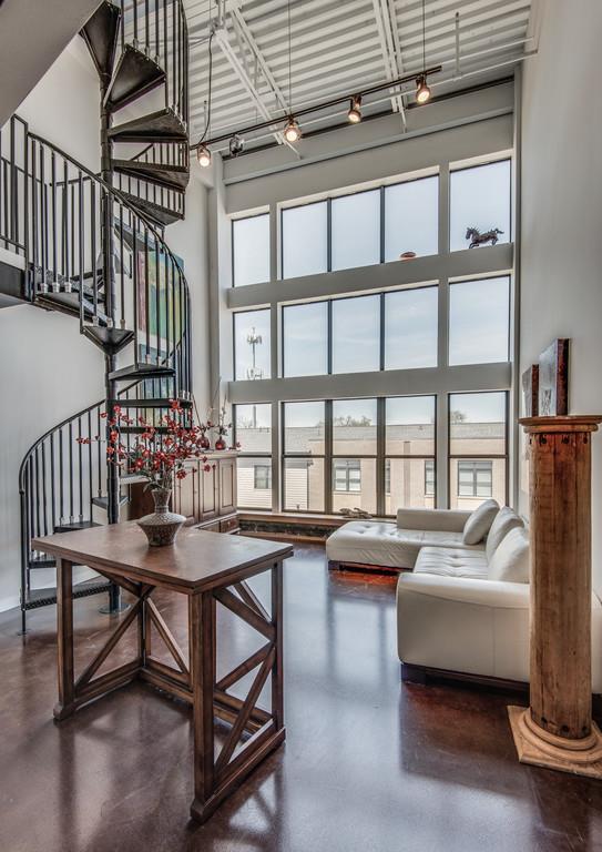 1400 Rosa L Parks Boulevard, Unit 323 Nashville, TN 37208 - Photo 10 of 25 a view of a livingroom with furniture window and wooden floor