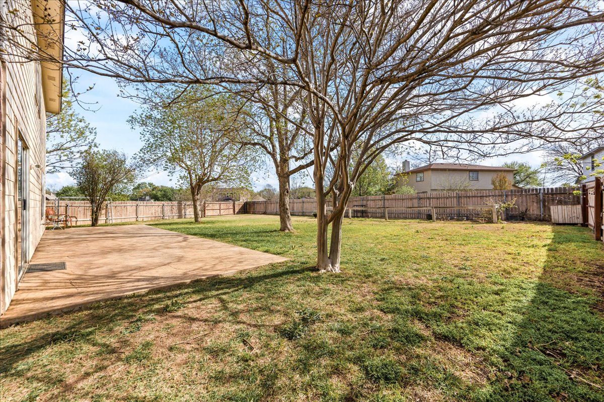 116 Devon's Cove Buda, TX 78610 - Photo 5 of 38 Fenced backyard featuring a patio