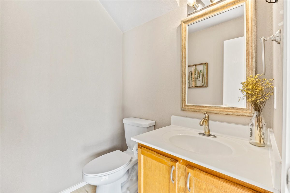 116 Devon's Cove Buda, TX 78610 - Photo 7 of 38 Bathroom featuring vanity and vaulted ceiling