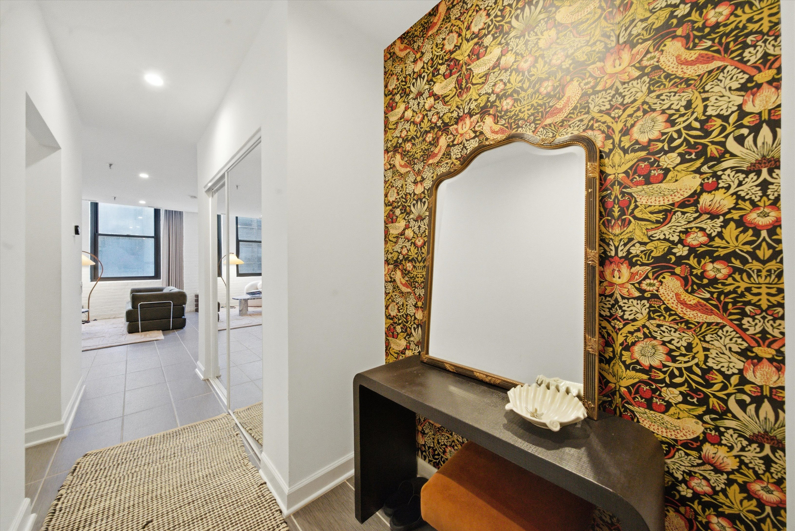 680 South Federal Street, Unit 807 Chicago, IL 60605 - Photo 11 of 17 a living room with a couch and a dining table