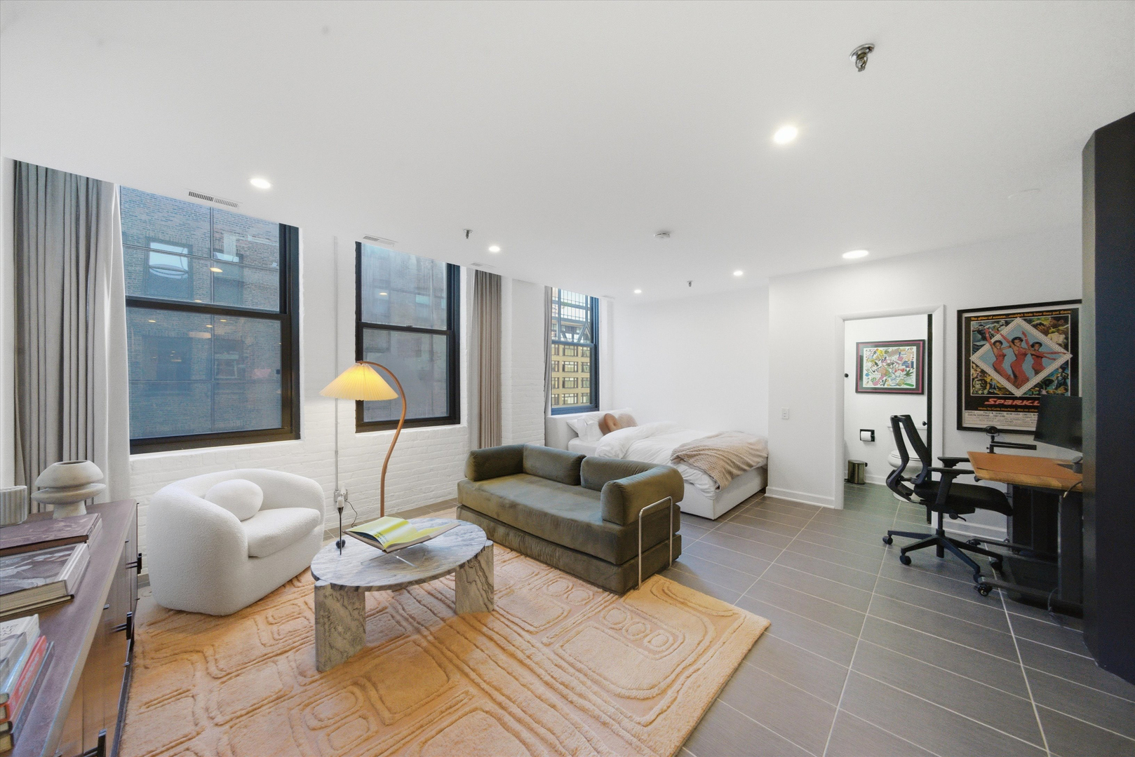 680 South Federal Street, Unit 807 Chicago, IL 60605 - Photo 7 of 17 a living room with furniture a rug and a table