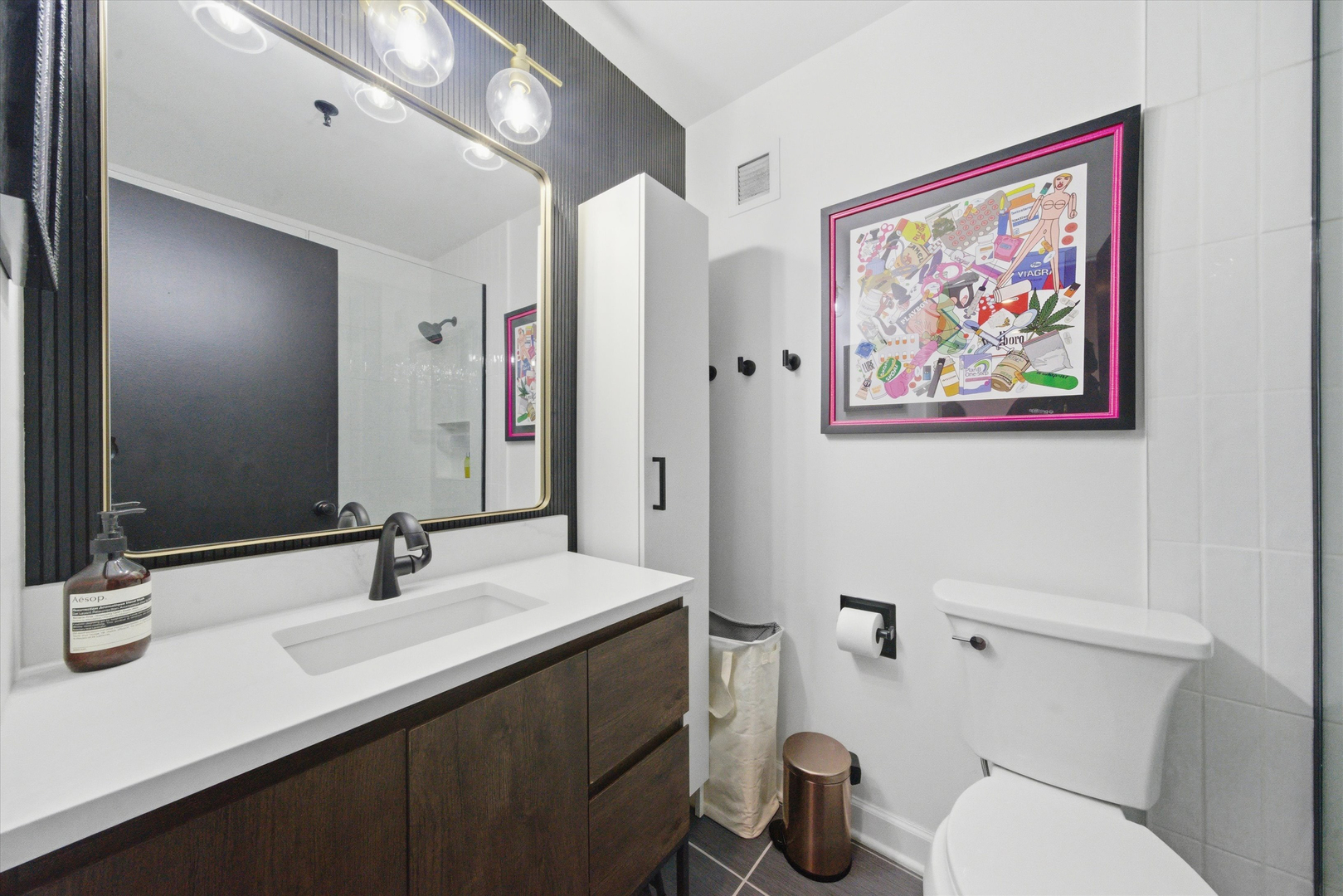 680 South Federal Street, Unit 807 Chicago, IL 60605 - Photo 9 of 17 a bathroom with a toilet a sink and mirror