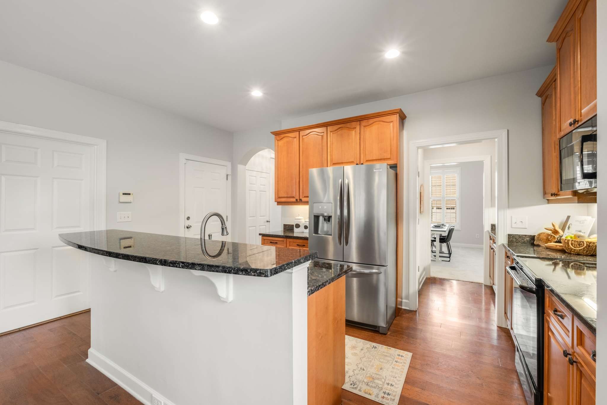 3005 Haviland Way Murfreesboro, TN 37128 - Photo 17 of 47 a kitchen with stainless steel appliances granite countertop a sink stove and refrigerator