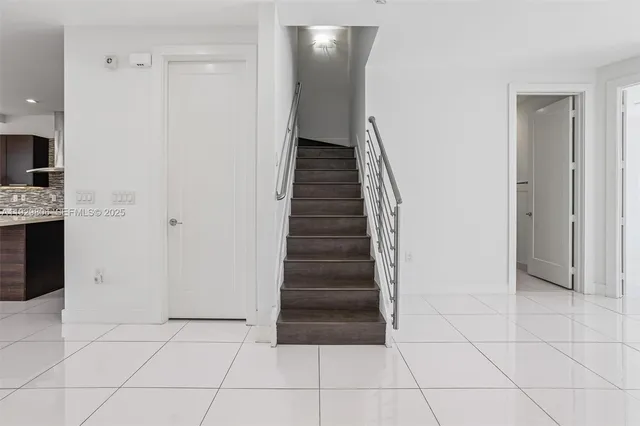 a view of entryway with cabinets