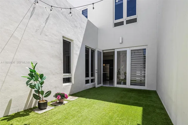 a view of a porch with a potted plant