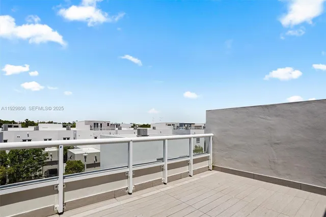 a view of a kitchen with a sink and a stove top oven