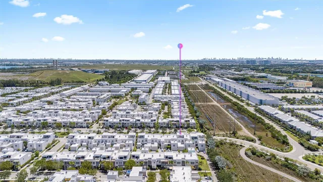 an aerial view of residential house with outdoor space and parking