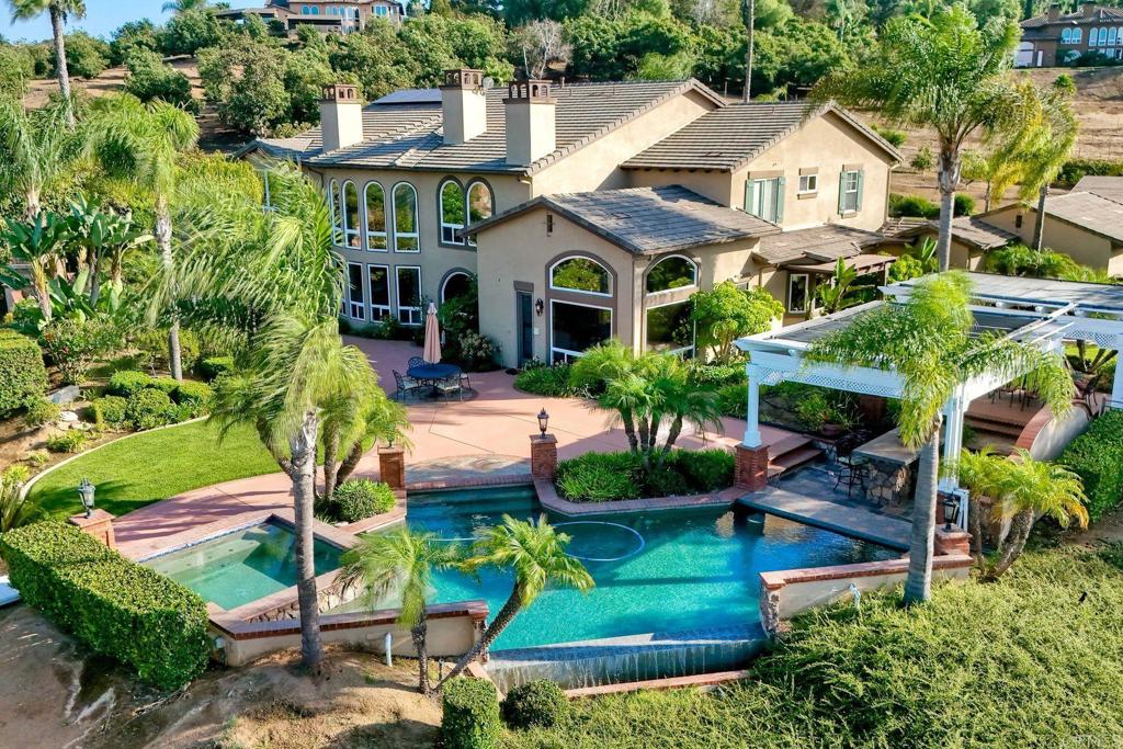 Great home & property for year round entertaining-pool, outdoor kitchen, sport court & putting green