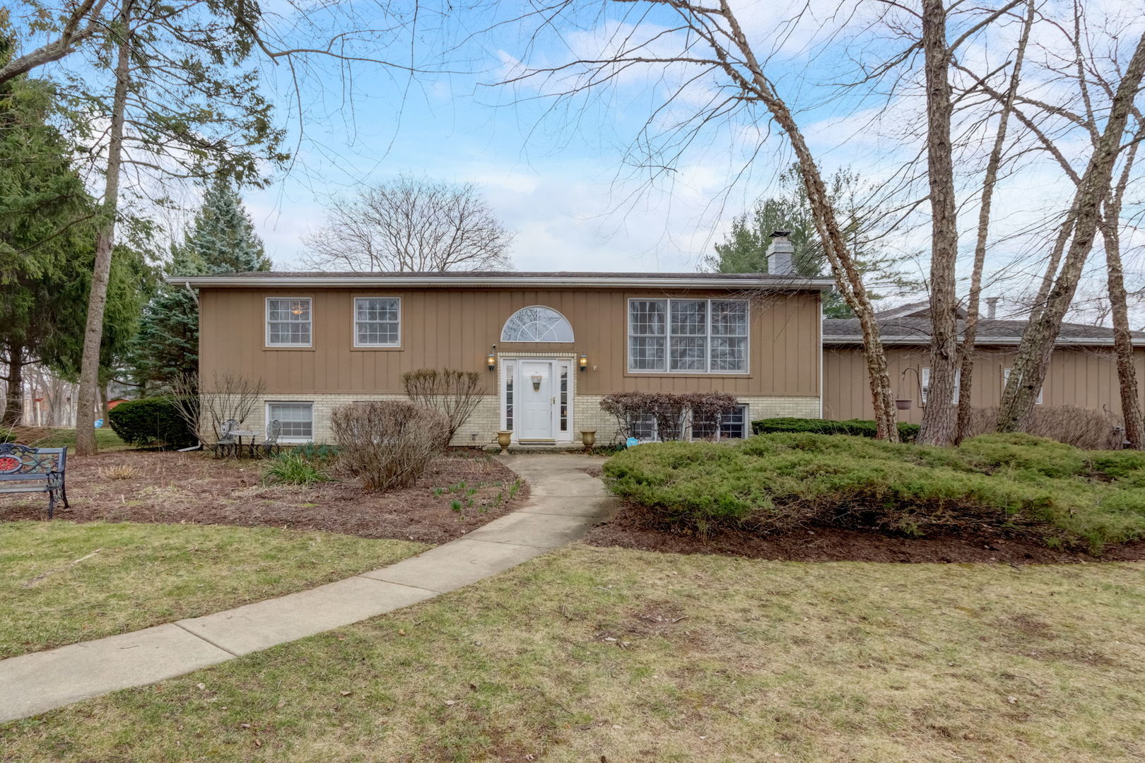 7N151 Longridge Road St. Charles, IL 60175 - Photo 1 of 46 a front view of a house with garden