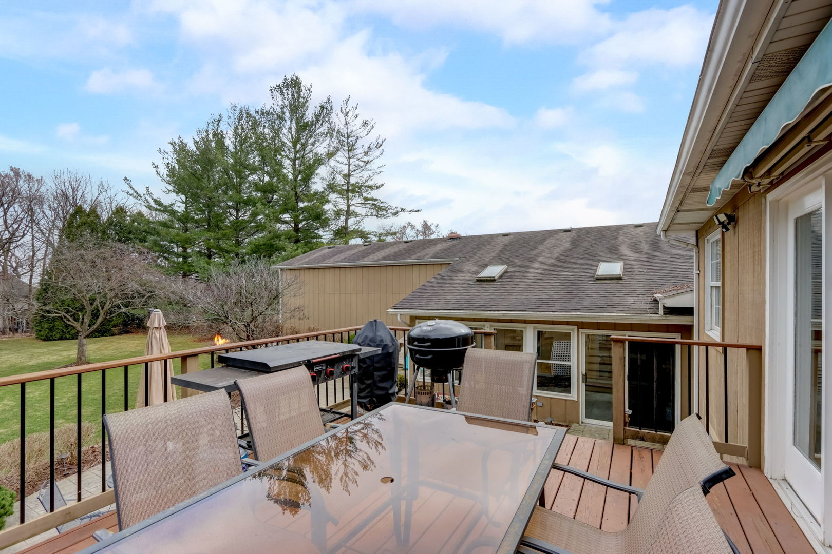 7N151 Longridge Road St. Charles, IL 60175 - Photo 35 of 46 a view of a patio with table and chairs with wooden floor and fence