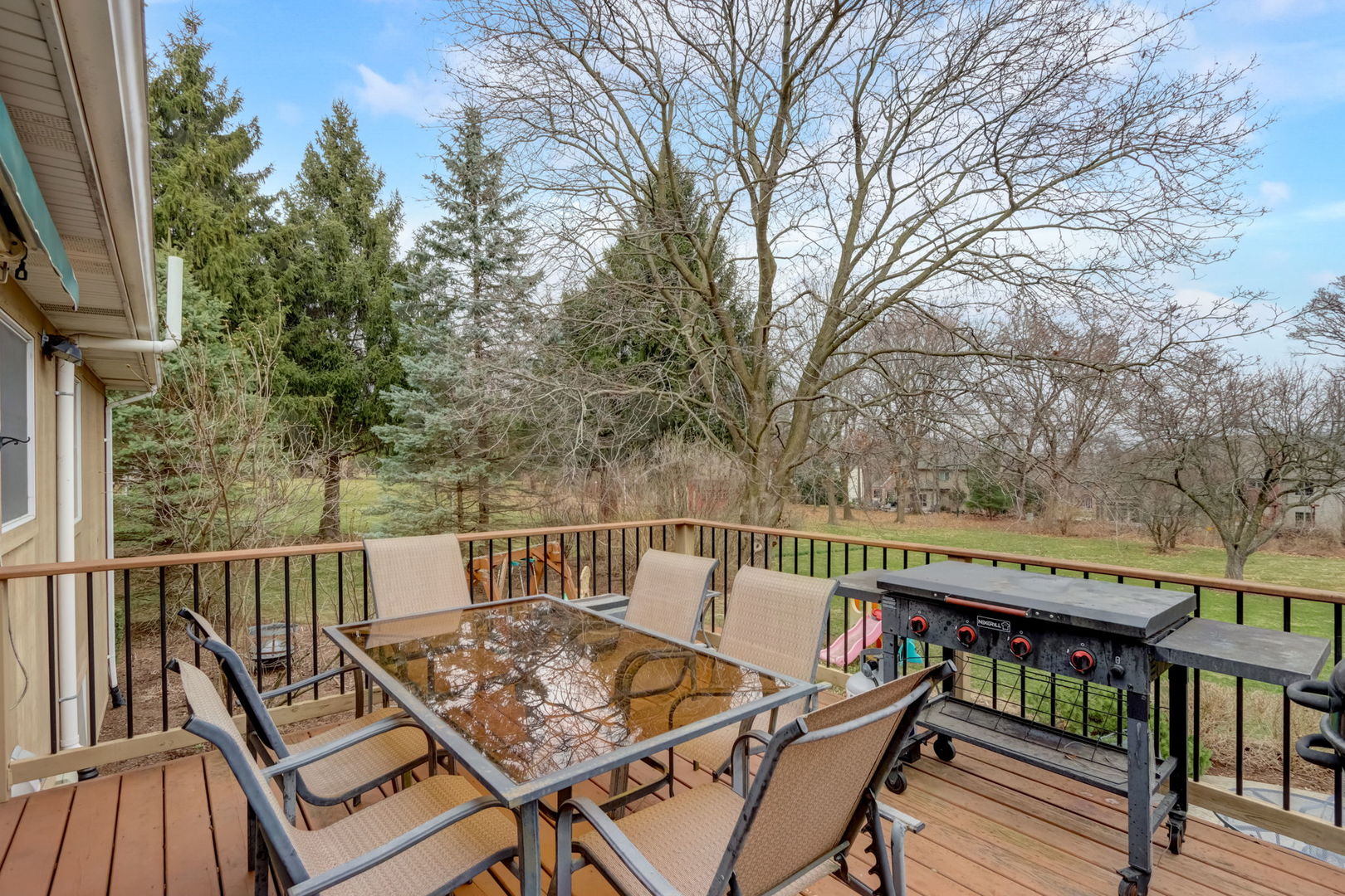 7N151 Longridge Road St. Charles, IL 60175 - Photo 36 of 46 a view of a balcony with wooden floor and outdoor seating