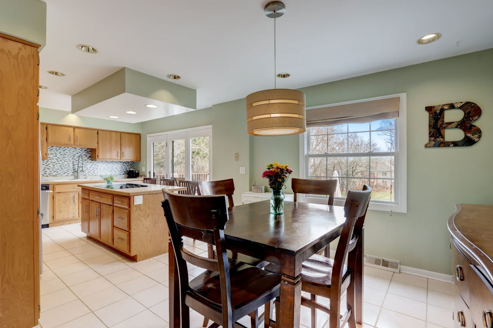 7N151 Longridge Road St. Charles, IL 60175 - Photo 7 of 46 a kitchen with stainless steel appliances granite countertop a sink a stove a dining table and chairs