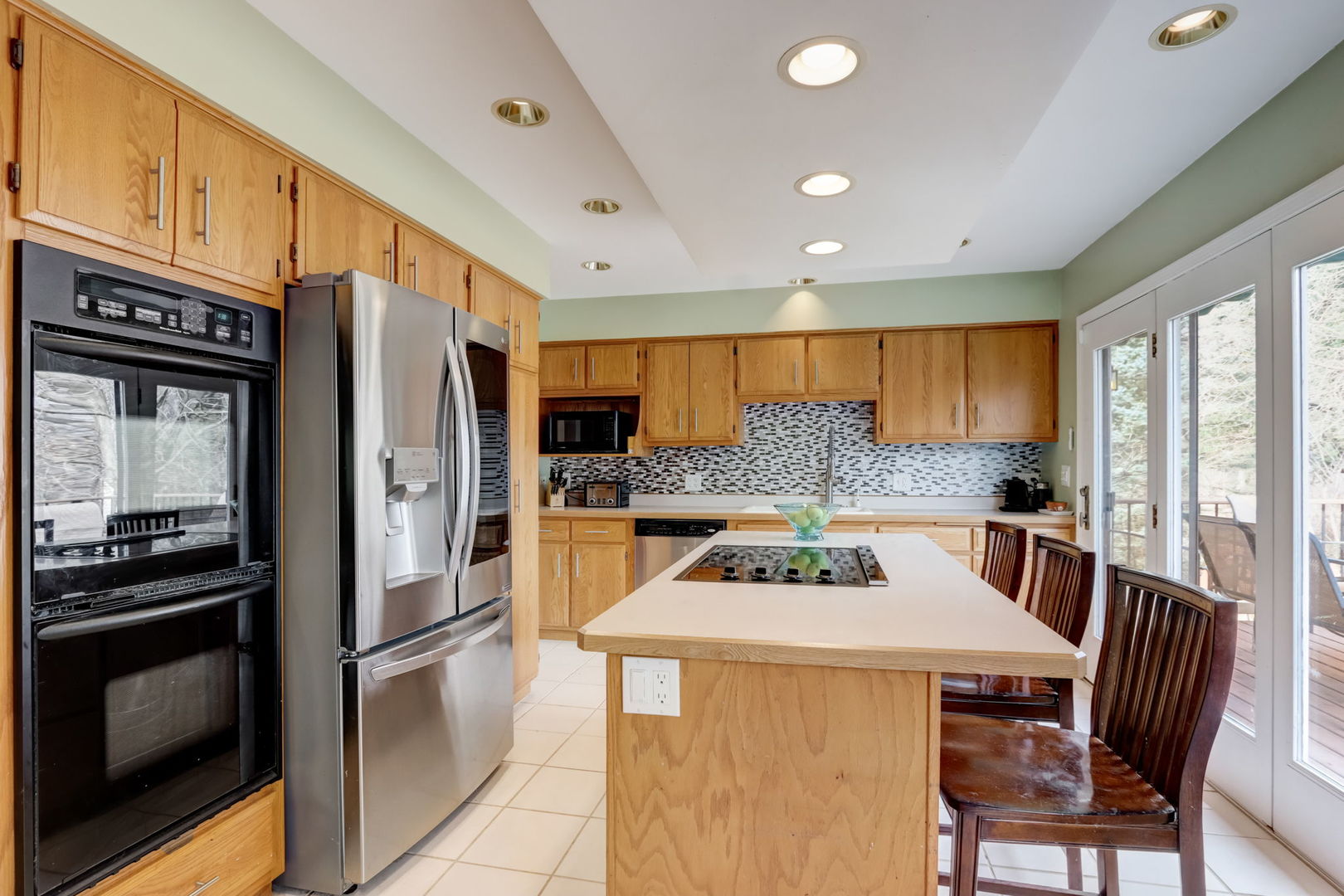 7N151 Longridge Road St. Charles, IL 60175 - Photo 8 of 46 a kitchen with stainless steel appliances a stove a refrigerator and a dining table