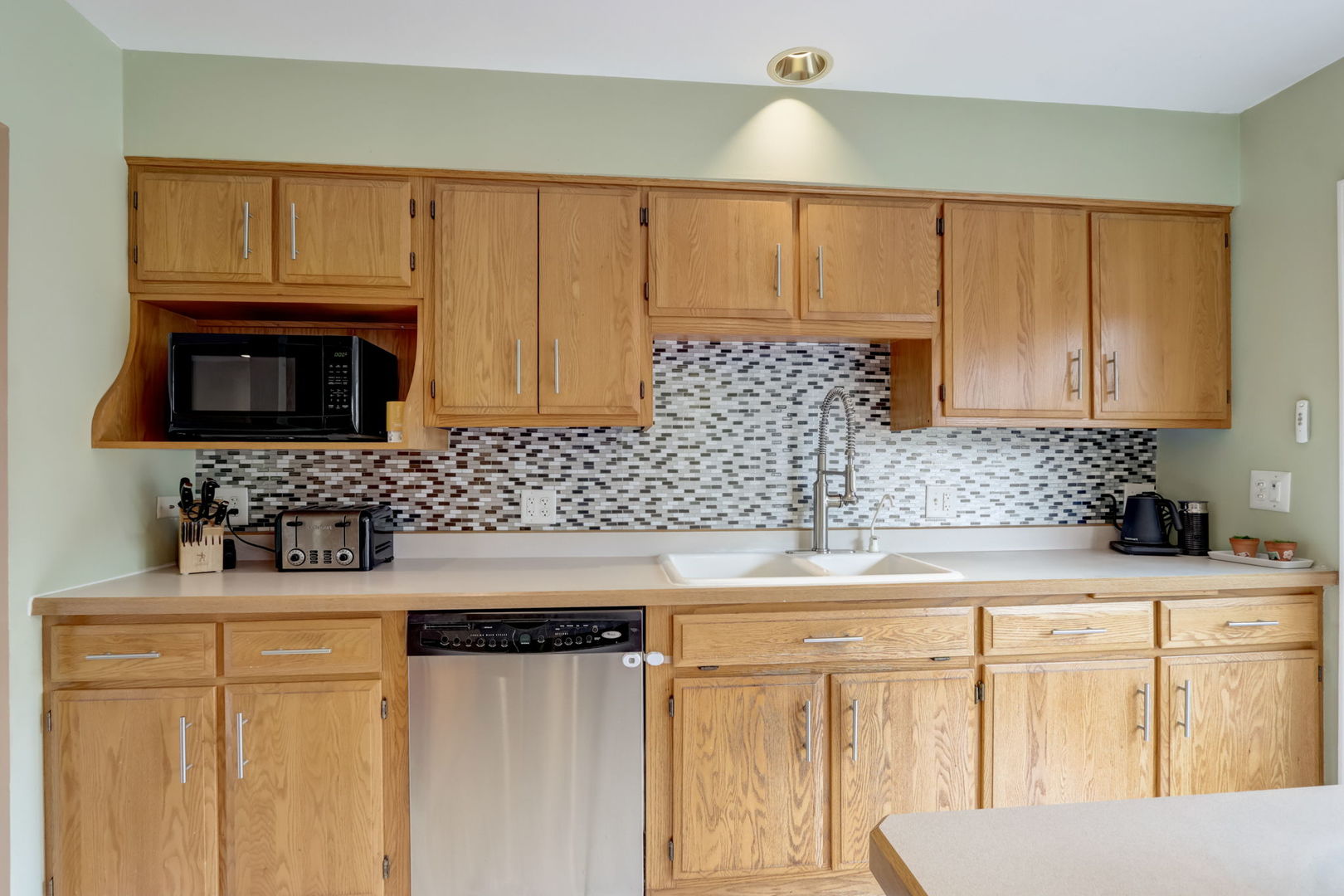 7N151 Longridge Road St. Charles, IL 60175 - Photo 10 of 46 a kitchen with stainless steel appliances granite countertop a sink stove and microwave