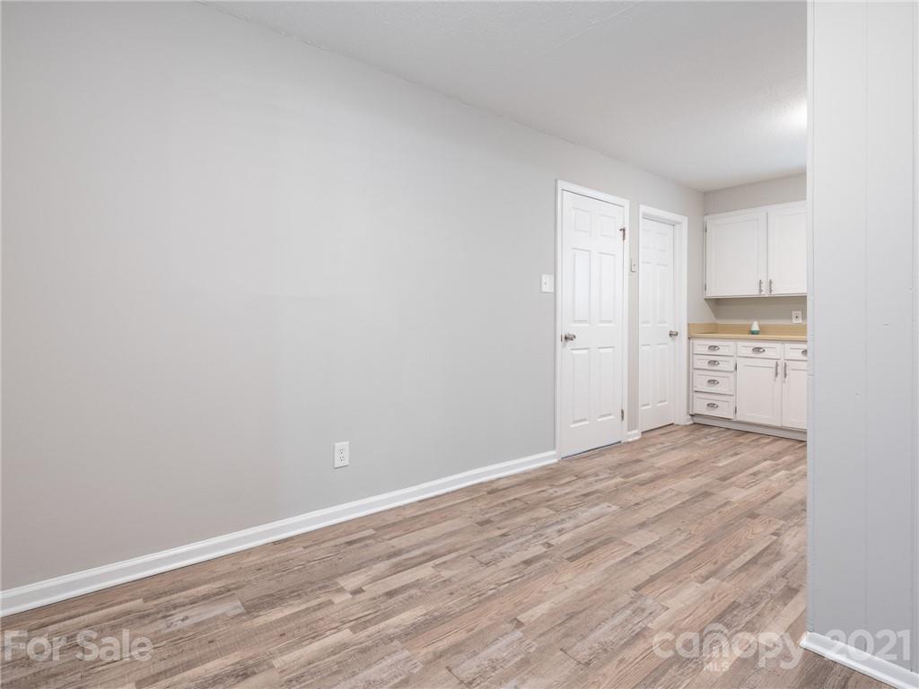 5344 Rockwood Road Charlotte, NC 28216 - Photo 12 of 31 a view of empty room with wooden floor
