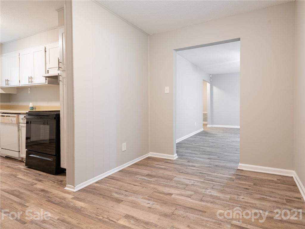 5344 Rockwood Road Charlotte, NC 28216 - Photo 20 of 31 a view of a kitchen with wooden floor and a sink