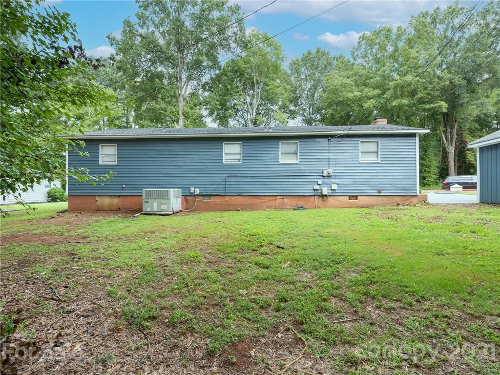 5344 Rockwood Road Charlotte, NC 28216 - Photo 30 of 31 a front view of a house with a yard and garage