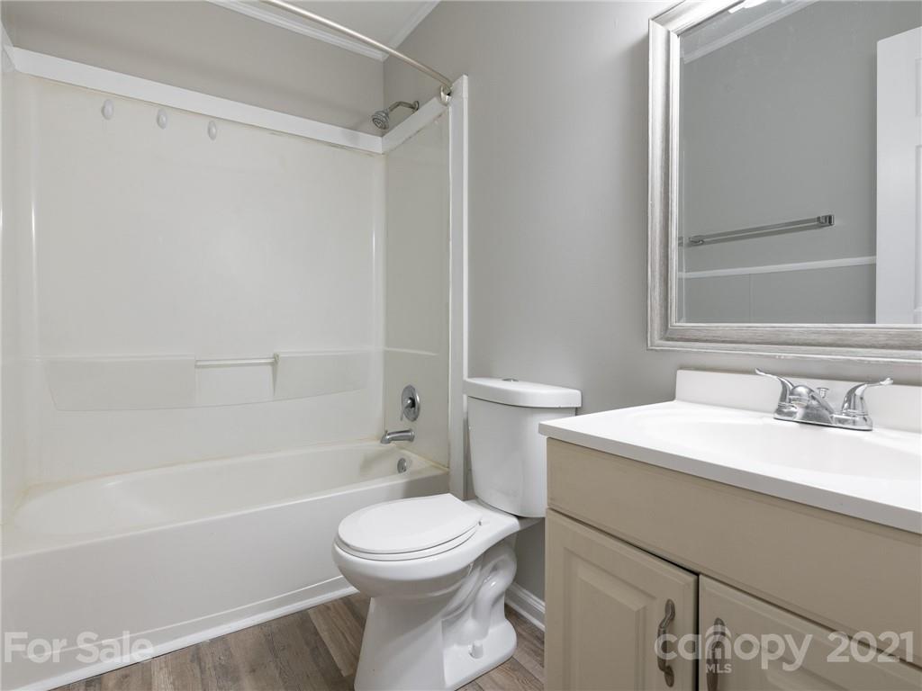 5344 Rockwood Road Charlotte, NC 28216 - Photo 5 of 31 a bathroom with a sink a toilet and shower