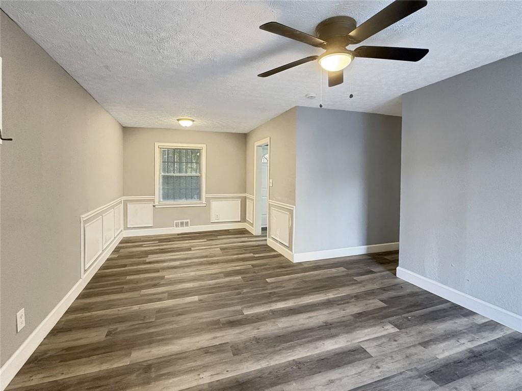 2955 Wanda Circle Southwest Atlanta, GA 30315 - Photo 3 of 10 a view of an empty room with a window and a ceiling fan