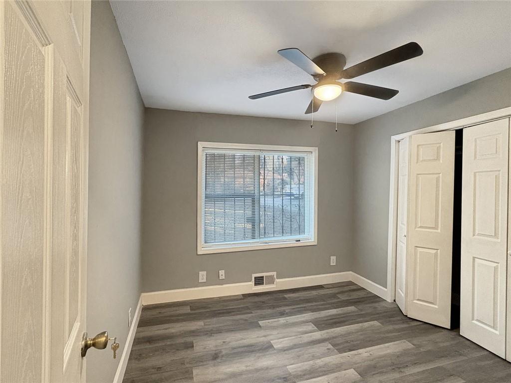 2955 Wanda Circle Southwest Atlanta, GA 30315 - Photo 6 of 10 a view of an empty room with a window and wooden floor