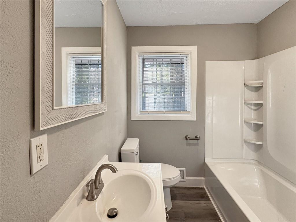 2955 Wanda Circle Southwest Atlanta, GA 30315 - Photo 7 of 10 a bathroom with a sink toilet and bathtub