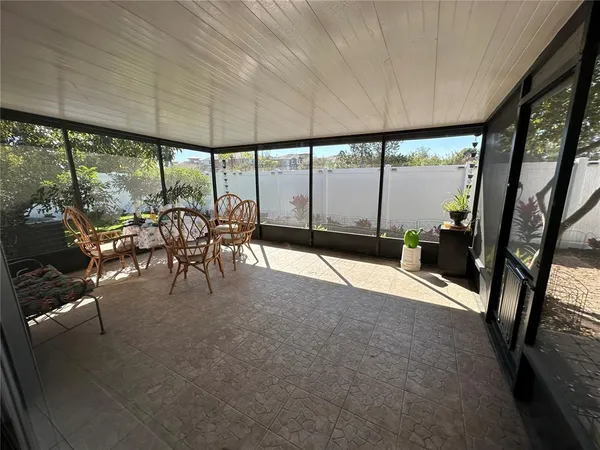 a view of a patio with a table chairs and a patio