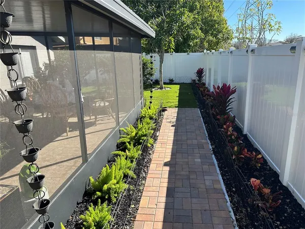 a view of a potted flower in a corridor