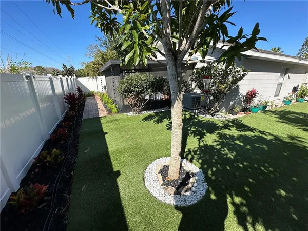 a backyard of a house with lots of green space