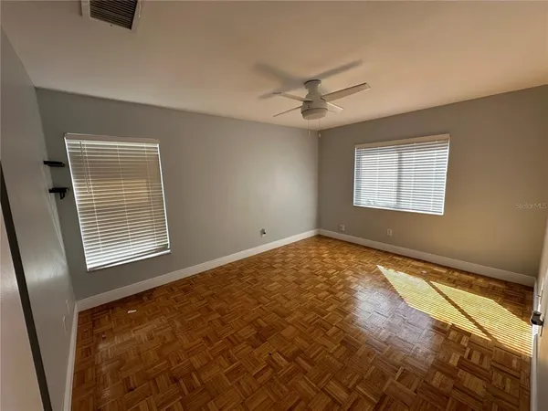 a view of an empty room and a window