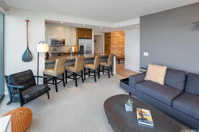 a living room with furniture and a large window