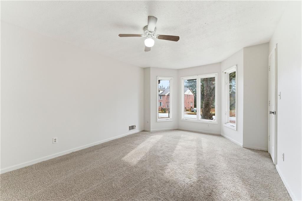 2130 Fieldstone View Court Southeast, Unit B Conyers, GA 30013 - Photo 12 of 18 a view of an empty room with a window