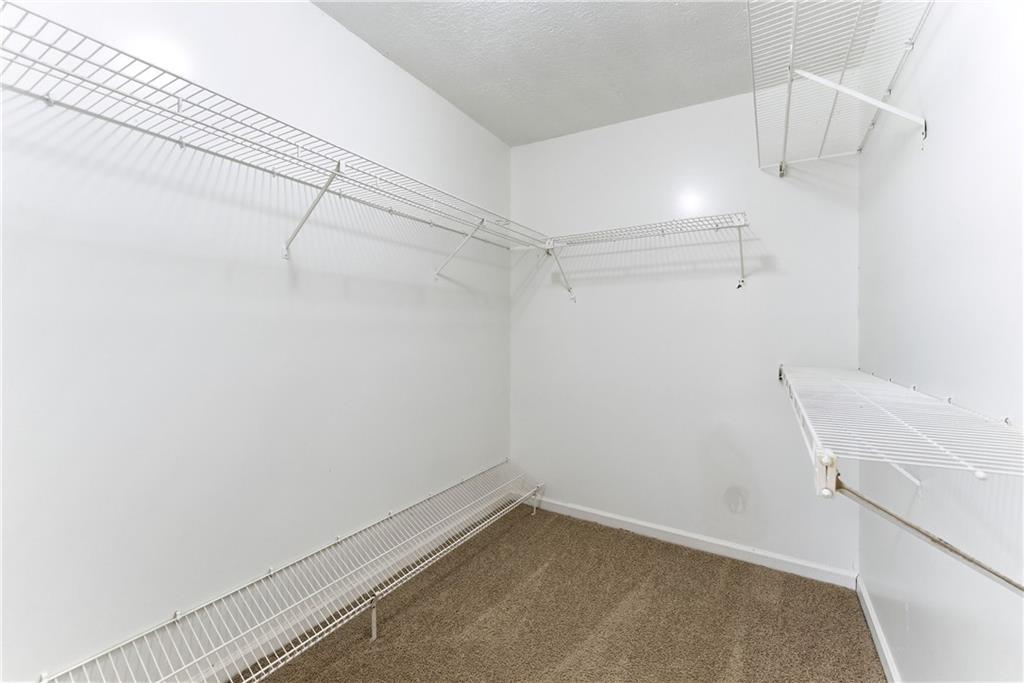 2130 Fieldstone View Court Southeast, Unit B Conyers, GA 30013 - Photo 14 of 18 a view of a room with racks on the wall