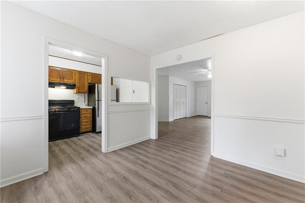 2130 Fieldstone View Court Southeast, Unit B Conyers, GA 30013 - Photo 6 of 18 a kitchen with a refrigerator and a stove