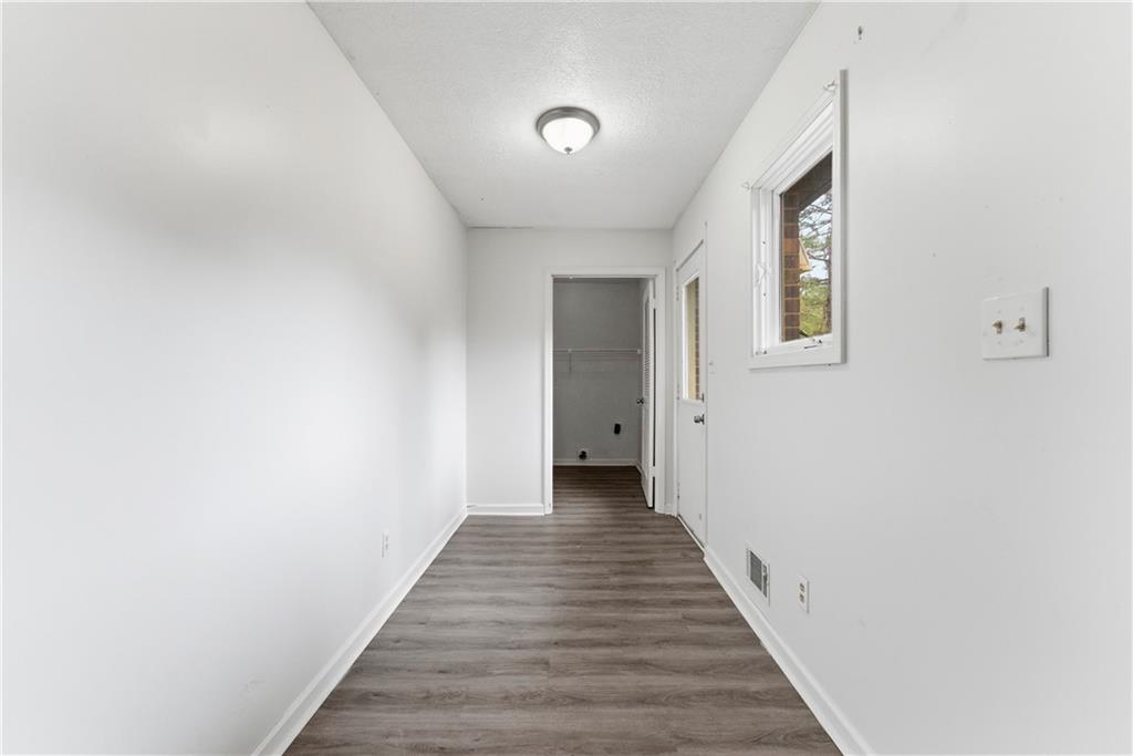 2130 Fieldstone View Court Southeast, Unit B Conyers, GA 30013 - Photo 9 of 18 a view of a hallway with wooden floor