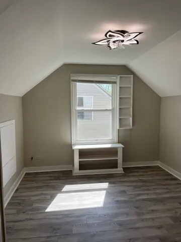 a bathroom with a bathtub and a window