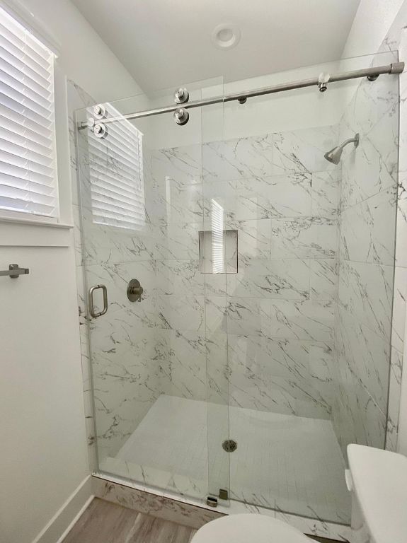 6809 Montana Street, Unit 2 Austin, TX 78741 - Photo 16 of 29 a bathroom with a shower and a toilet