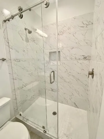 a view of a backyard with wooden fence