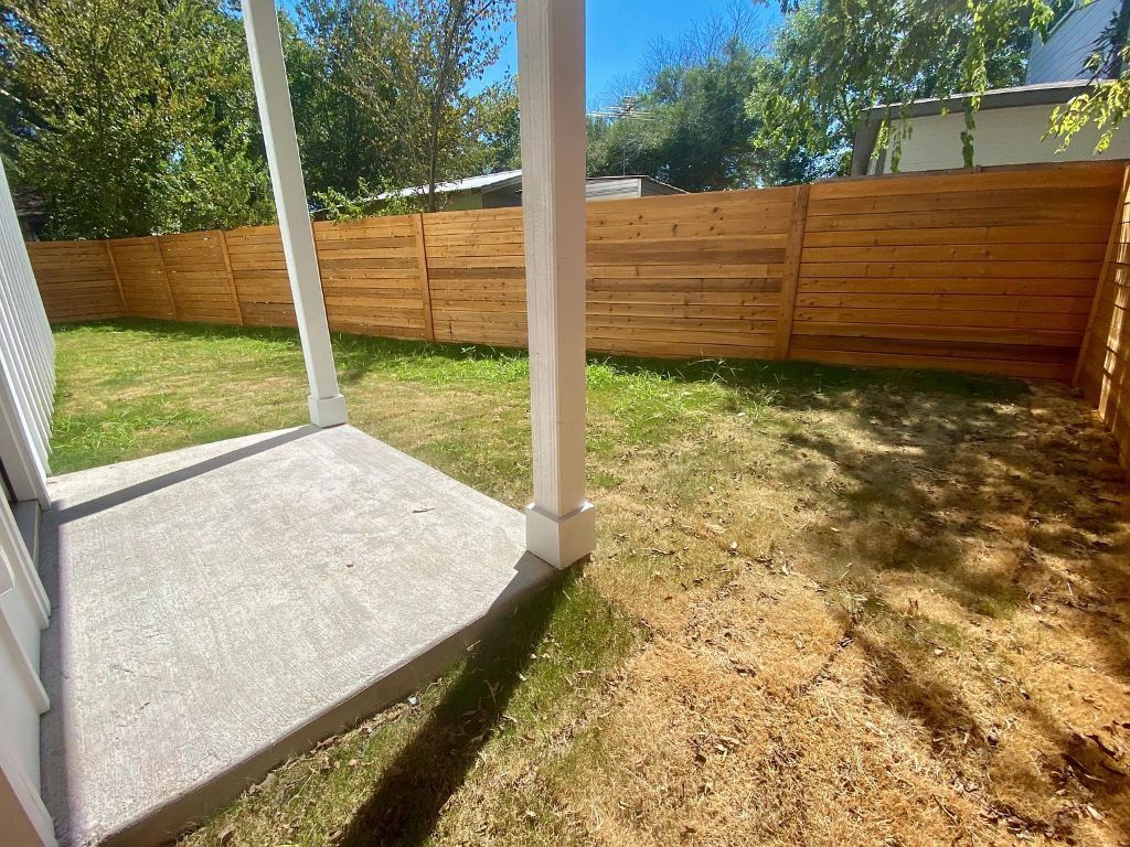 6809 Montana Street, Unit 2 Austin, TX 78741 - Photo 26 of 29 a view of a backyard with wooden fence