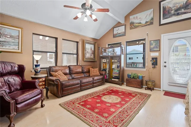a living room with furniture rug and window