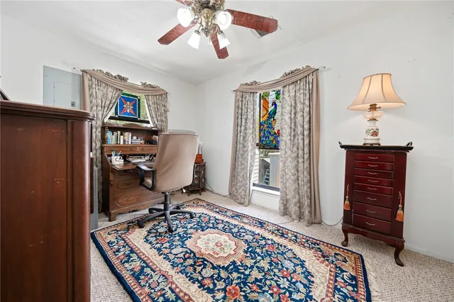 a bedroom with furniture and a window