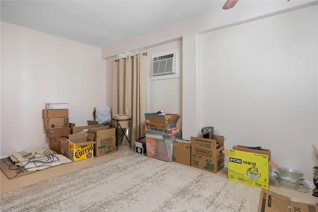 a bed room with furniture and a window