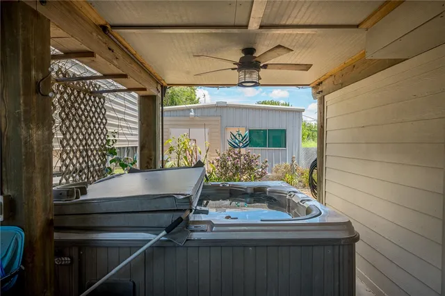 a room with pool table and windows