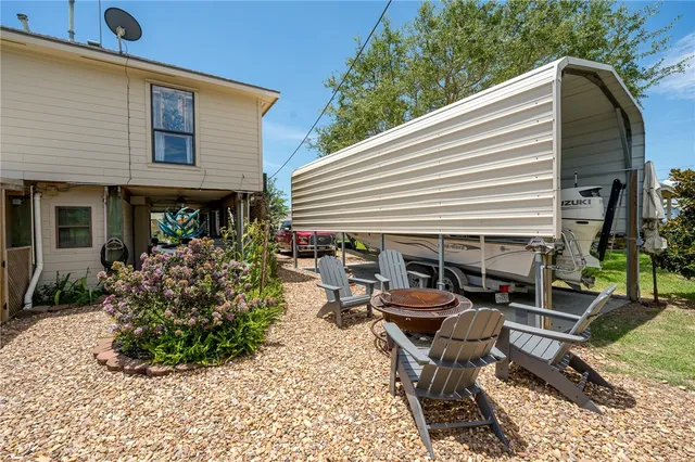 a view of a chairs and table in a patio