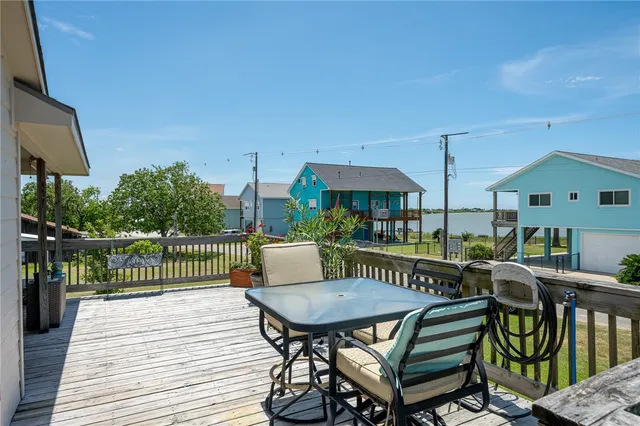 a view of a patio with a table and chairs