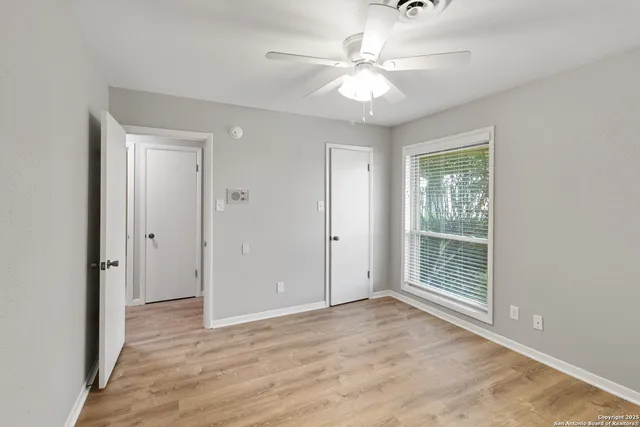 a view of a kitchen with a sink and cabinets