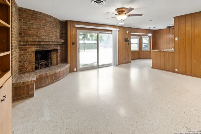 a view of a kitchen with a sink and a refrigerator