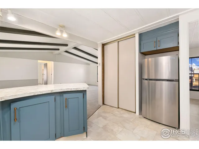 a kitchen with stainless steel appliances a refrigerator and a sink