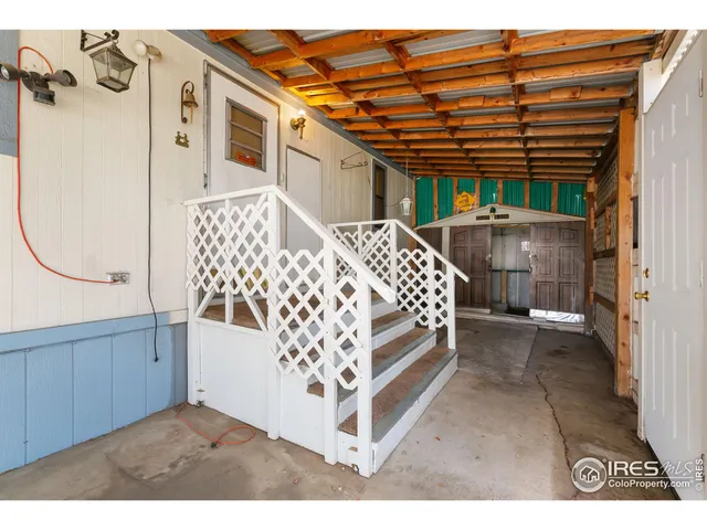 a view of a porch with a table and chair