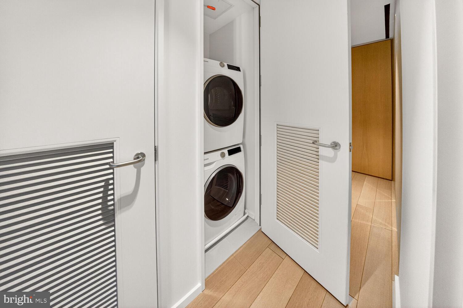 920 I Street Northwest, Unit 704 Washington, DC 20001 - Photo 11 of 24 a view of a hallway with washer and dryer